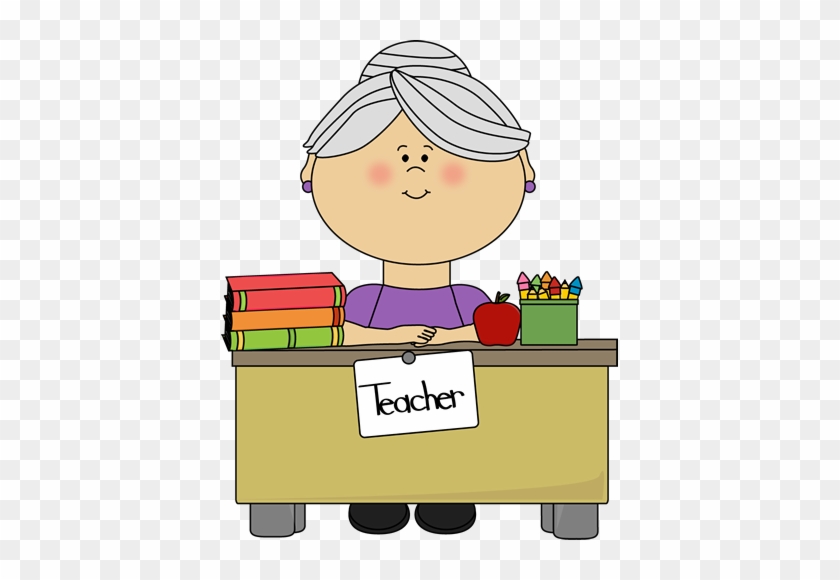 Teacher With Gray Hair Sitting At A Desk - School Teacher Clipart #979112